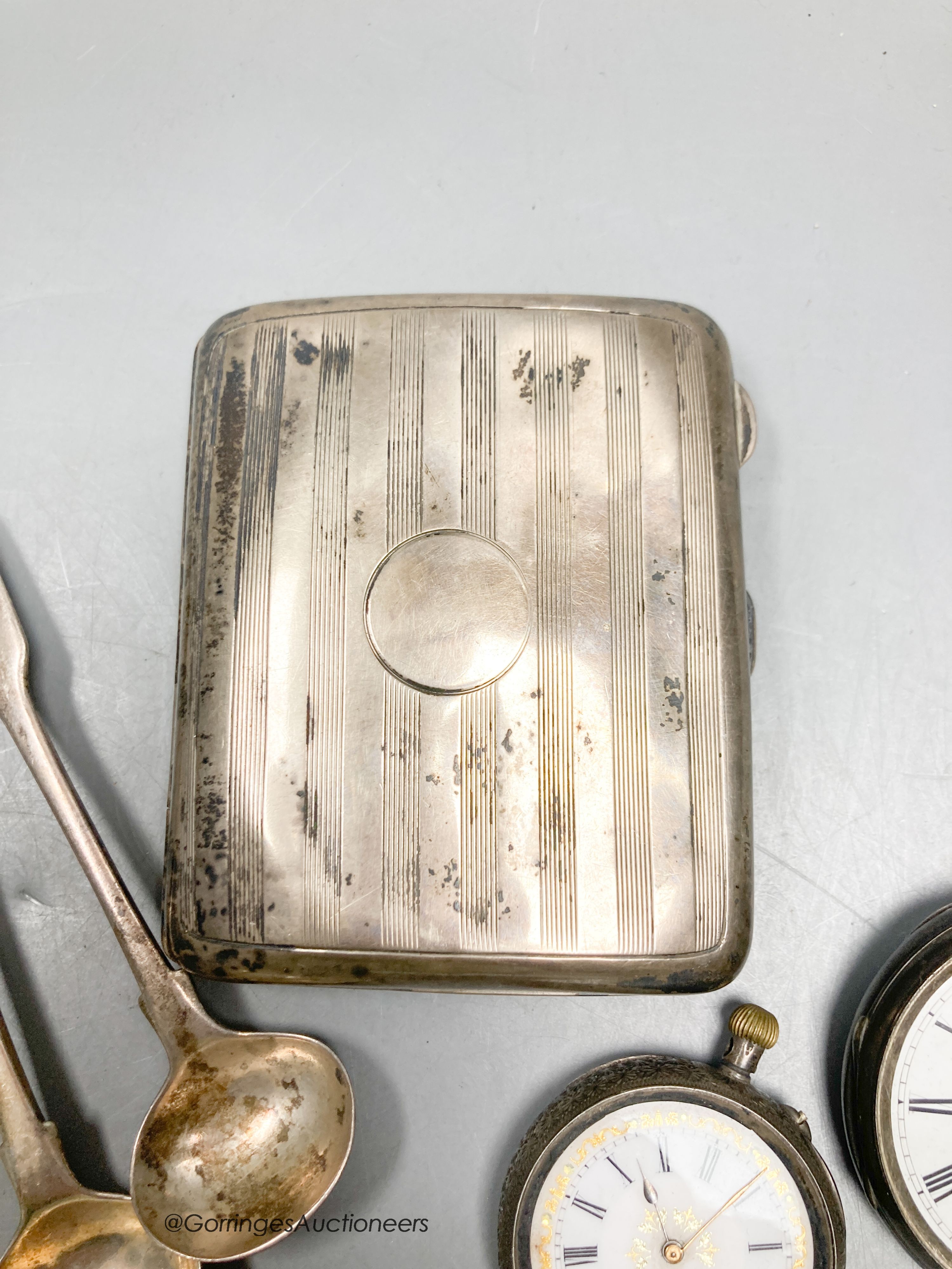 A silver cigarette case, two pocket watches, small pot etc.